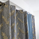 Curtains with leaf pattern and blue color swatch on a white background